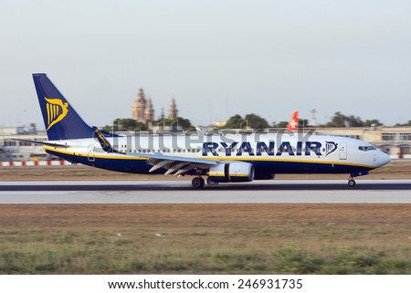 Luqa, Malta July 10, 2008: Ryanair Boeing 737-8AS landing runway 14, just as the sun is about to set.