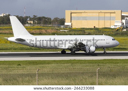 Luqa, Malta April 2, 2015: Smartlynx Airlines Airbus A320-211 landing runway 31, operating a Ryanair flight.