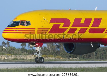 Luqa, Malta April 28, 2015: DHL (European Air Transport - EAT) Boeing 757-236(SF) D-ALEE lined up on runway 31 awaiting take off clearance in the evening.