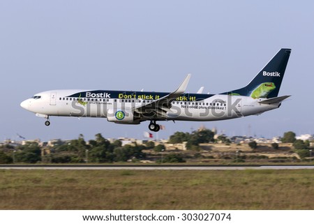 Luqa, Malta August 3, 2015: Transavia France Boeing 737-8K2 in a 2 month old logo-jet advertising adhesives company Bostik color scheme.