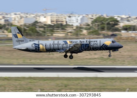 Luqa, Malta August 18, 2015: West Air Europe Cargo British Aerospace ATP landing midfield runway 31.