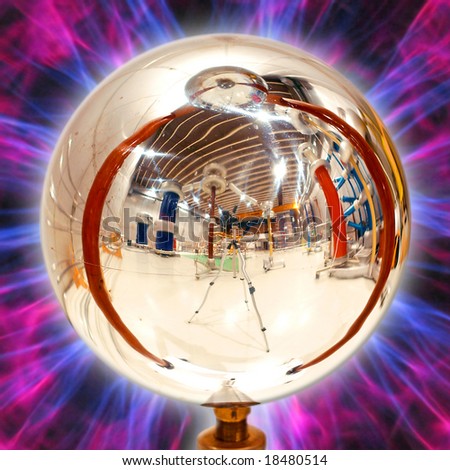 Distorted reflection of high voltage equipment in a polished steel sphere (spark gap)