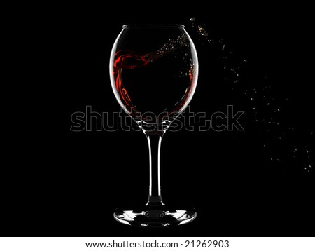 Isolated wine glass with red wine heart-like curl inside it and splashes outside. For other similar images from the series, please, check my portfolio.