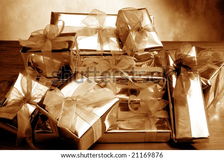 background image of golden color gift-box on the table
