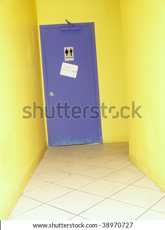 an image of a restroom door written out of order