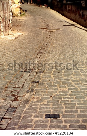 close up shot of a cobblestone alley in Ayvalik Turkey