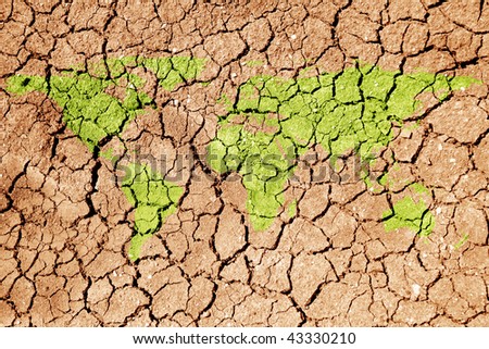 conceptual image of dried soil with flat world map