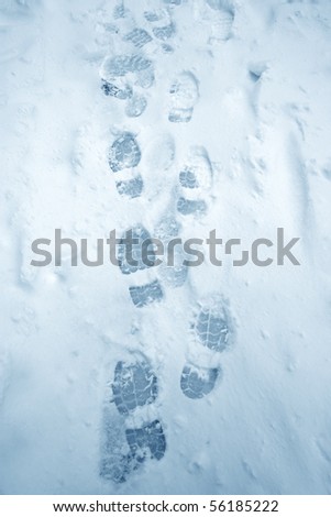 elevated view of footprints on snow covered ground