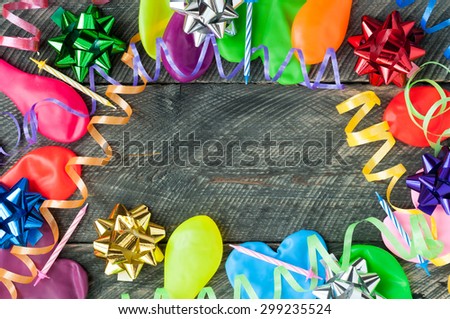 Happy birthday backgrounds. Balloons, streamers, ribbons, bows and candles on wooden table