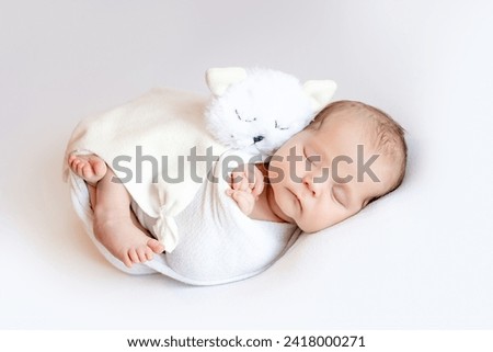 Image, Stock Photo Adorable little baby boy in feeding chair being spoon fed by his mother