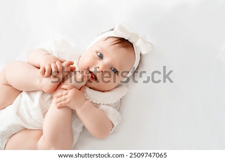 Image, Stock Photo Portrait of sweet baby resting in mothers arms, looking at camera, touching mama shoulder. New mom holding little kid, embracing child with tenderness, love, care. Motherhood concept.