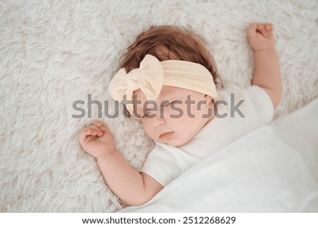 Similar – Image, Stock Photo Little cute baby girl lying in basket