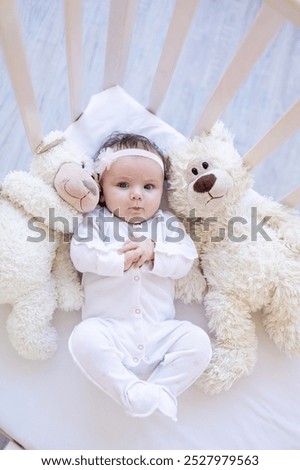 Similar – Image, Stock Photo Little cute baby girl lying in basket