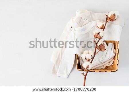 Cute newborn clothes. Organic cotton baby apparel mockup. Flat lay, top view