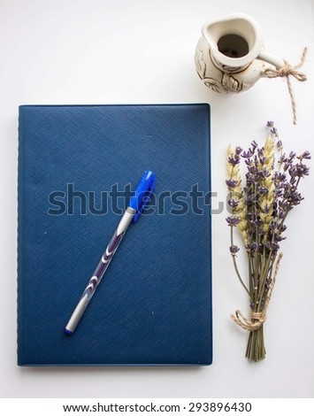 copybook, pen and lavender isolated on white