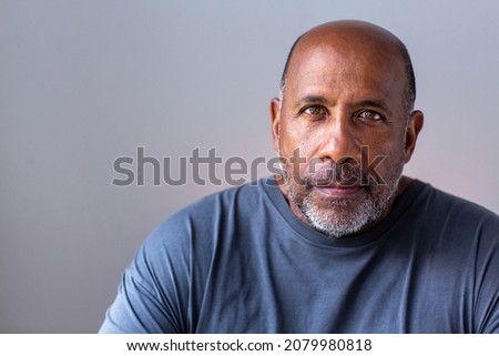 Similar – Image, Stock Photo Portrait of a sad, crouching man in a black hoodie