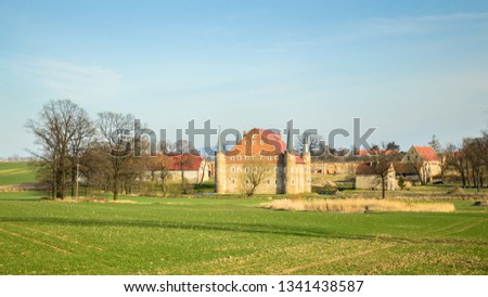 Folwark, a small castle with a moat and a pond. Zdjęcia stock © 