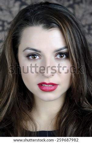 woman face calm brown eyes brown-haired woman on background with ornament