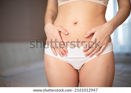 Mom's abdomen after cesarean section. Scar seam. bodypositive diversity Real motherhood. Lifestyle. High quality photo Imagine de stoc © 