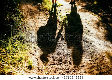 Similar – Foto Bild Schatten von zwei Personen auf dem Kopfsteinpflaster