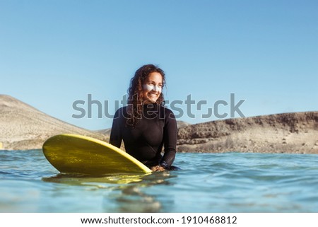 Similar – Image, Stock Photo surf woman with yellow board on her arms on the french coast