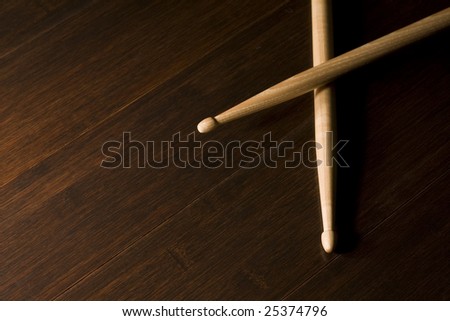 Pair of Wood Drumsticks on Bamboo floor