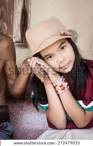 vintage of asian kids little girl  hand touches and holds an old man wrinkled hands at face of her
