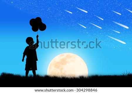 Silhouette of little boy hand hold bubble look at meteor shower and star on the sky