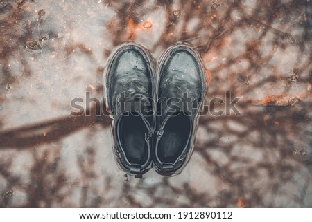 Image, Stock Photo Boots over puddle top view