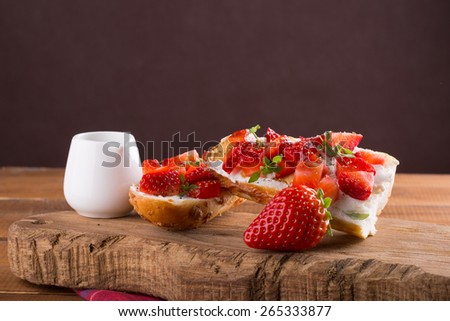 Bruschetta with strawberry, cheese, basil and balsamic vinegar
