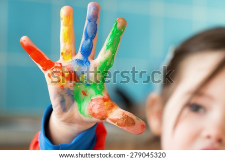 A painted hand of a little girl