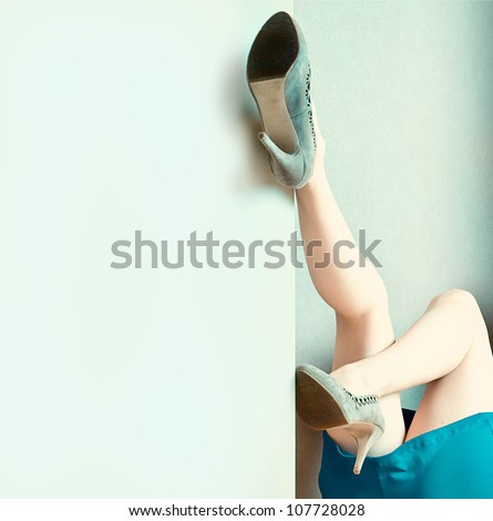 Sexy woman\'s legs up against a wall