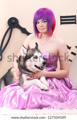 young woman, siberian husky dog and big clock