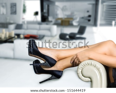 Woman\'s leg and high heel black shoes