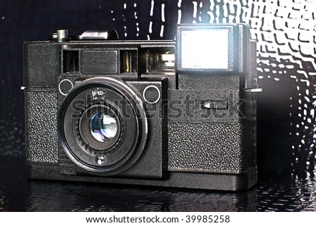 old film camera on dark background