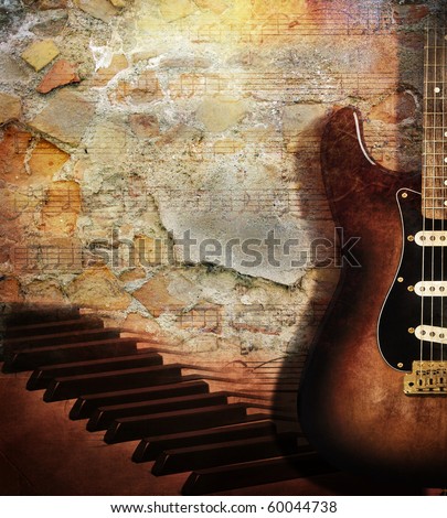 Vintage grunge style background With guitar and piano on brick wall