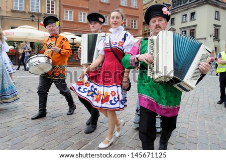 WARSAW - AUGUST 25: Folklore ensemble ROSSIJANA from Russia - street parade during the International Folklore Festival WARSFOLK on August 25, 2011 in Warsaw, Poland.