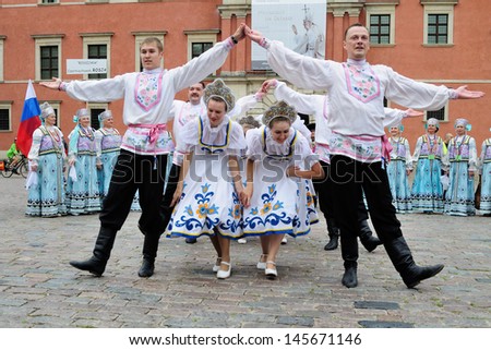 WARSAW - AUGUST 25: Folklore ensemble ROSSIJANA from Russia - street parade during the International Folklore Festival WARSFOLK on August 25, 2011 in Warsaw, Poland.