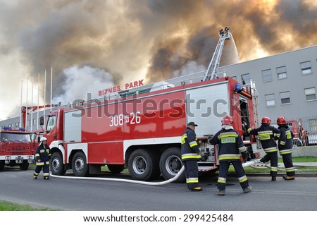 WOLKA KOSOWSKA, POLAND - MAY 10: Firefighters extinguish a raging fire in a China Mart storehouse, May 10, 2011 in Wolka Kosowska, Poland. The fire burned 150 storage units covering nearly 2 hectares