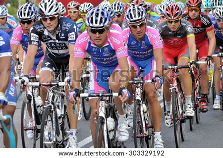 WARSAW, POLAND - AUGUST 1, 2010: Cyclists along the route of the cycling race \