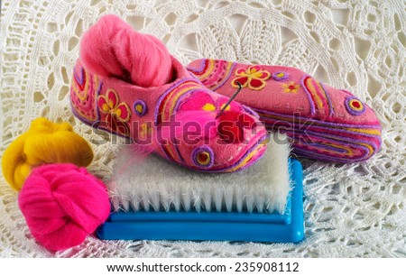 slippers, needles, brush and  wool for  felting