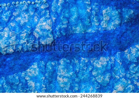 Turquoise  fabric texture of wool with lace.  Craft background
