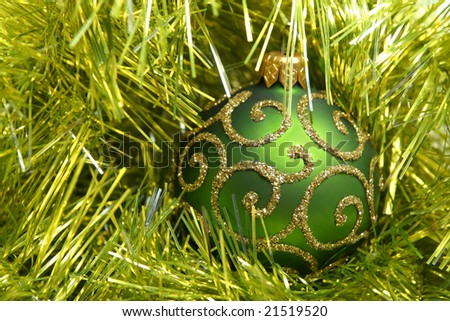 Green decoration ball in tinsel.