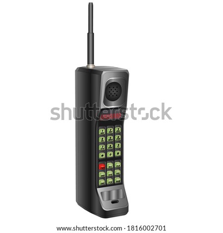 
A big, old, black cell phone with an antenna, green buttons,and red numbers. One of the first wireless phones