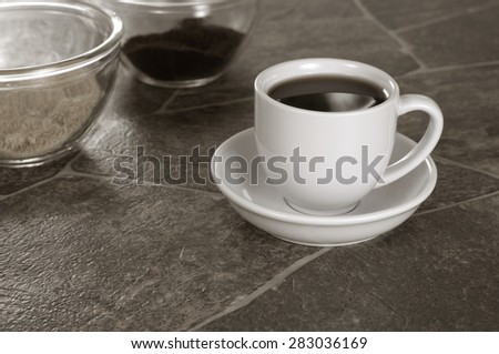 Sepia Tone White Coffee Cup on Granite Counter
