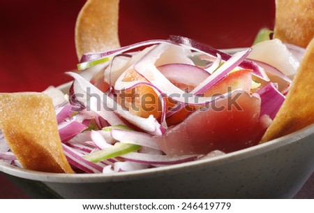 A BOWL OF SUSHI SALAD - A sushi dish of salmon and tuna with grated onion and cucumber