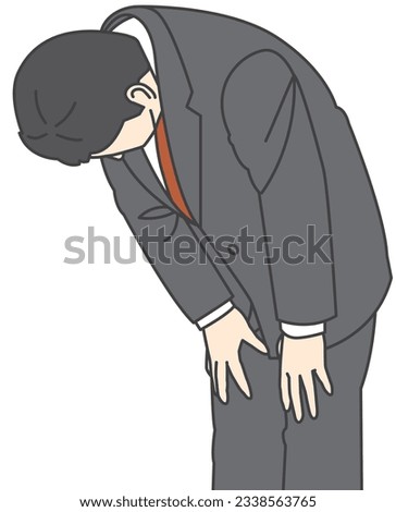 A man in a suit bowing his head