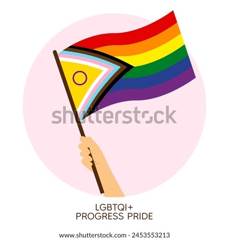 Hand holding rainbow progressive pride flag