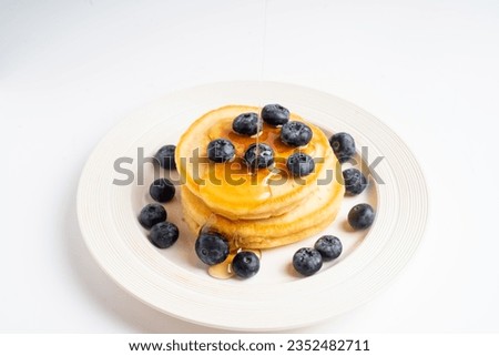 Similar – Image, Stock Photo Blueberries and honey on dark background, top view