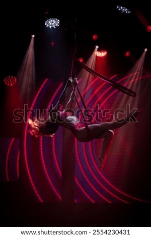 Similar – Image, Stock Photo Graceful acrobat performs with hoop on beach